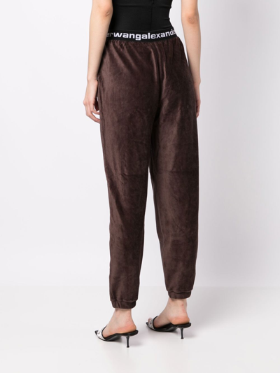 Shop Alexander Wang Logo-waistband Tapered Trousers In Brown