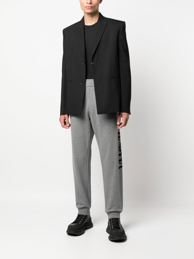 Shop Versace Logo-print Slim-cut Track Pants In Grey