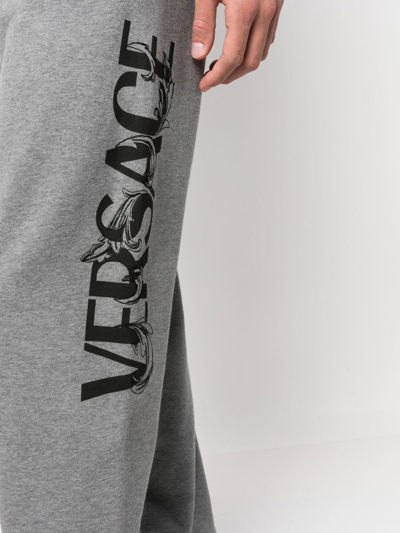 Shop Versace Logo-print Slim-cut Track Pants In Grey