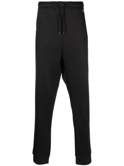 Shop Raf Simons Tapered Track Pants In Black
