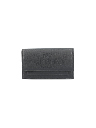 Shop Valentino Debossed Logo Belt Bag In Nero