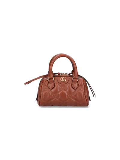 Shop Gucci Matelassé 'gg' Bag In Marrone