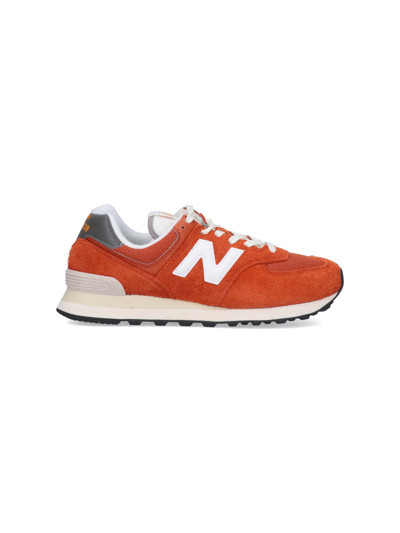New Balance 574 Sneakers In Arancione | ModeSens