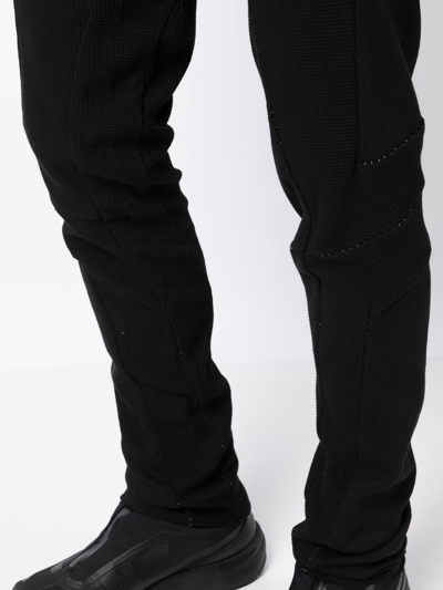 Shop Masnada Waffle-knit Tapered-leg Trousers In Black