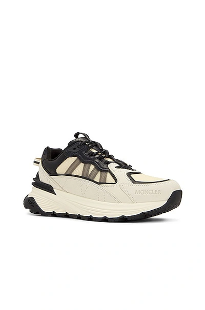 Shop Moncler Lite Runner Low Top Sneakers In White & Black