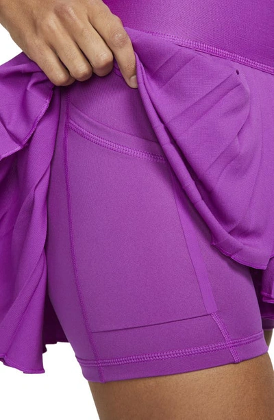 Shop Nike Court Dri-fit Advantage Pleated Tennis Skirt In Vivid Purple/ White