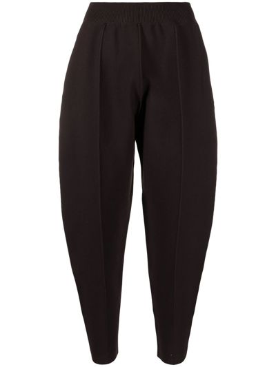 Shop Issey Miyake Tapered Cropped Knitted Trousers In Brown