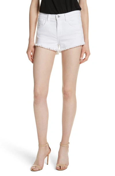 Shop L Agence Zoe Cutoff Denim Shorts In Blanc