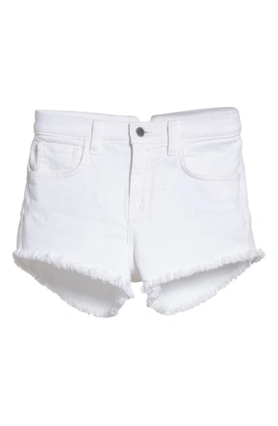 Shop L Agence Zoe Cutoff Denim Shorts In Blanc