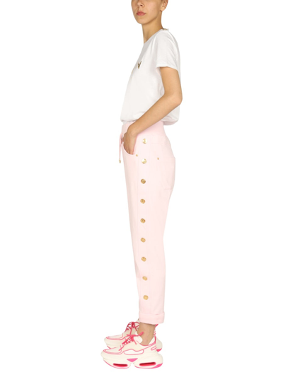 Shop Balmain Jogging Pants With Embossed Buttons In Pink