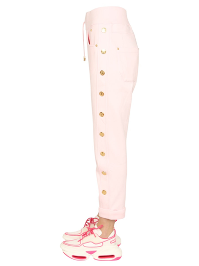 Shop Balmain Jogging Pants With Embossed Buttons In Pink