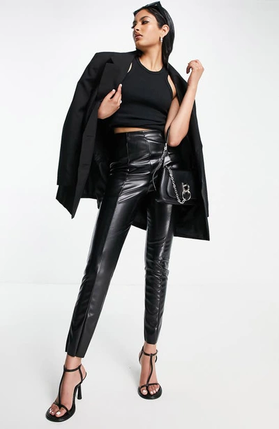 Shop Asos Design Faux Leather Skinny Pants In Black