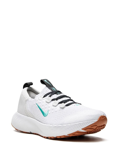 Shop Nike Escape Run Flyknit Sneakers In White