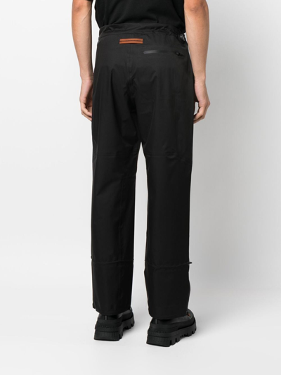 Shop Zegna Toggle-cuff Straight-leg Trousers In 黑色
