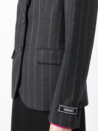 Shop Versace Ges Logo-pinstripe Blazer In Black
