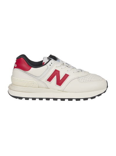 Shop New Balance 574 Sneakers In White