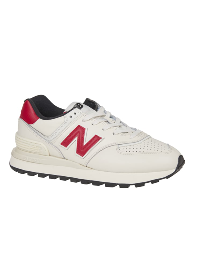 Shop New Balance 574 Sneakers In White
