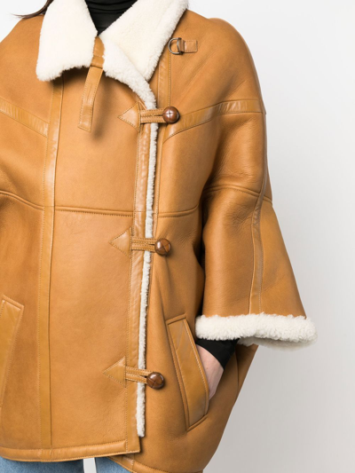 Shop Saint Laurent Panelled Toggle Cape Jacket In Neutrals