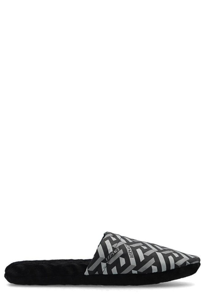 Shop Versace La Greca Monogram Slippers In Black