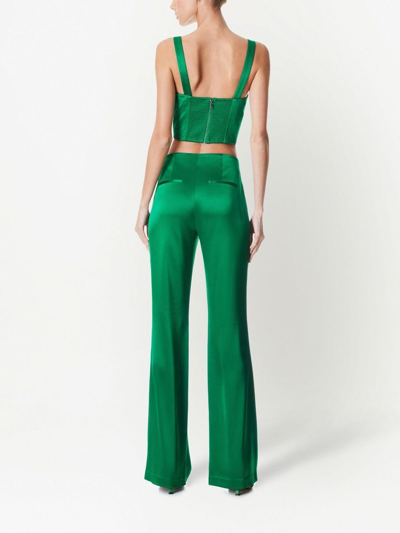 Shop Alice And Olivia Teeny Satin Flared Pants In Green