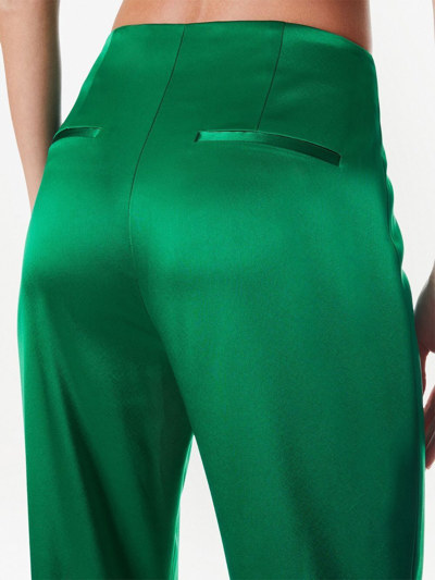 Shop Alice And Olivia Teeny Satin Flared Pants In Green