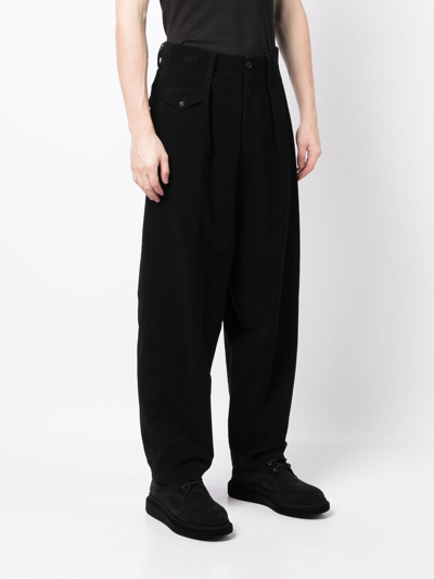 Shop Yohji Yamamoto Pleated Wide-leg Trousers In Black