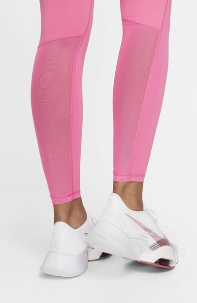 Shop Nike Pro Mid Rise Leggings In Pinksicle/ Black/ White