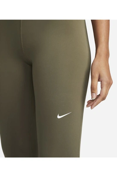 Shop Nike Pro Mid Rise Leggings In Medium Olive/ Black/ White