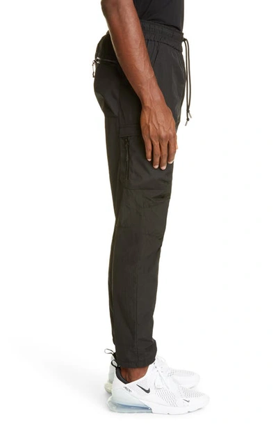 Shop John Elliott High Shrunk Nylon Water Repellent Cargo Pants In Black