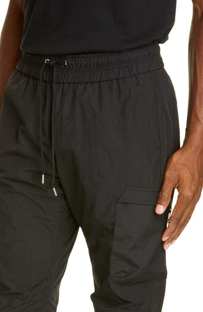 Shop John Elliott High Shrunk Nylon Water Repellent Cargo Pants In Black