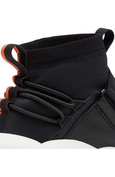 Shop Sorel Explorer Defy Mid Top Sneaker In Black/ Sea Salt