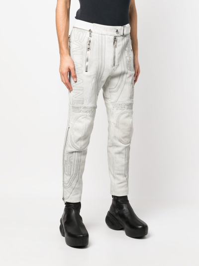 Shop Balmain Embroidered-design Tapered Leather Trousers In 白色