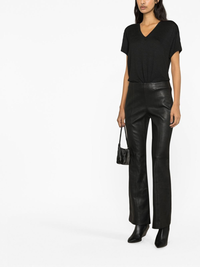 MID-RISE FLARED LEATHER TROUSERS