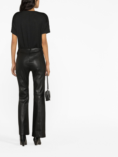 MID-RISE FLARED LEATHER TROUSERS