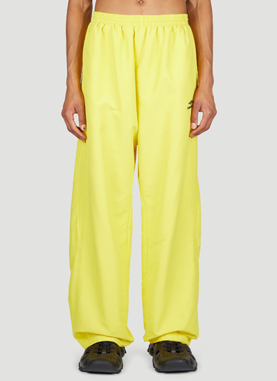 Shop Balenciaga Logo Print Track Pants In Yellow