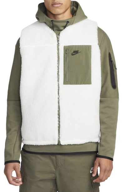 Shop Nike Club+ Reversible Winterized Vest In Sail/ Medium Olive/ Black