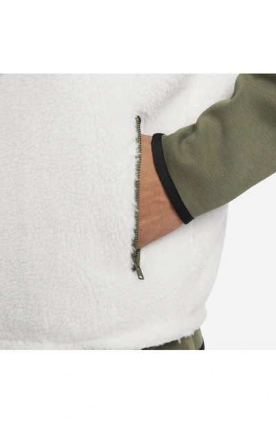 Shop Nike Club+ Reversible Winterized Vest In Sail/ Medium Olive/ Black