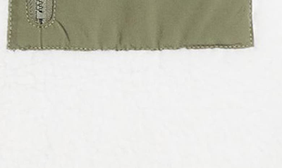 Shop Nike Club+ Reversible Winterized Vest In Sail/ Medium Olive/ Black
