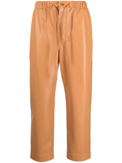 Shop Nanushka Jain Faux-leather Trousers In Brown
