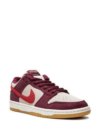 Shop Nike Sb Dunk Low "skate Like A Girl" Sneakers In Red