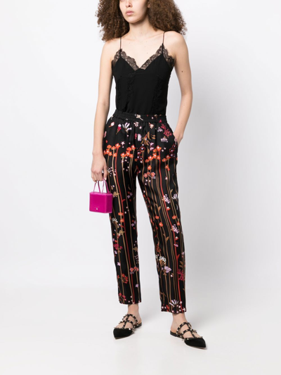 Shop Red Valentino Star-print Silk Trousers In Black