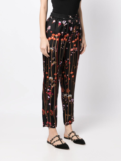 Shop Red Valentino Star-print Silk Trousers In Black