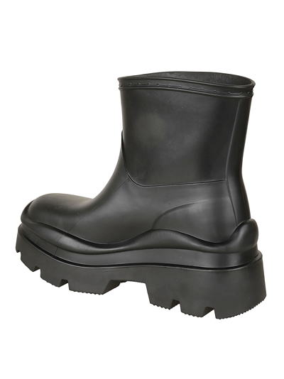 Shop Msgm Logo Embossed Rain Boots In Black