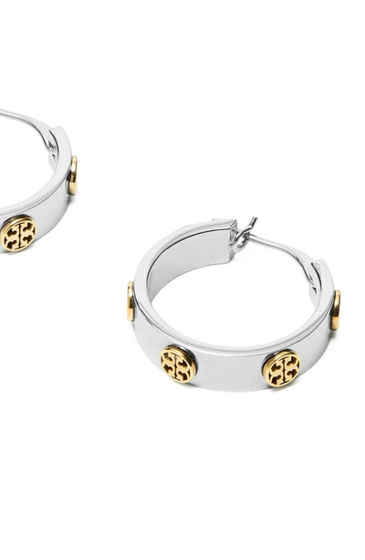 Shop Tory Burch Miller Huggie Hoop Earrings In Tory Silver / Tory Gold