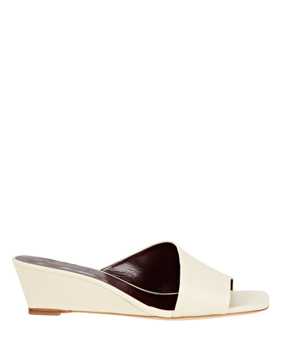 Shop Staud Nevil Asymmetric Leather Wedge Mules In White