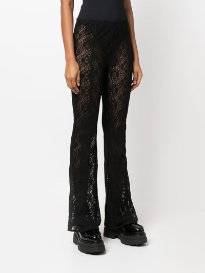 Ganni Lace Sheer Flared Trousers In Black