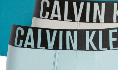 Shop Calvin Klein Assorted 3-pack Intense Power Micro Low Rise Trunks In Ocean Mist