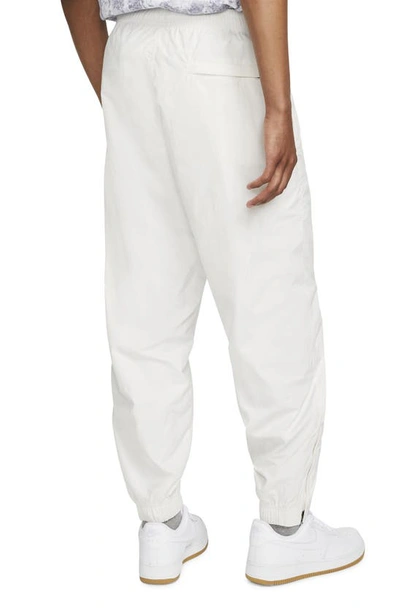 Shop Nike Sportswear Solo Swoosh Nylon Track Pants In Phantom/ White