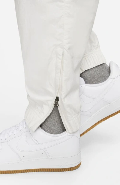 Shop Nike Sportswear Solo Swoosh Nylon Track Pants In Phantom/ White