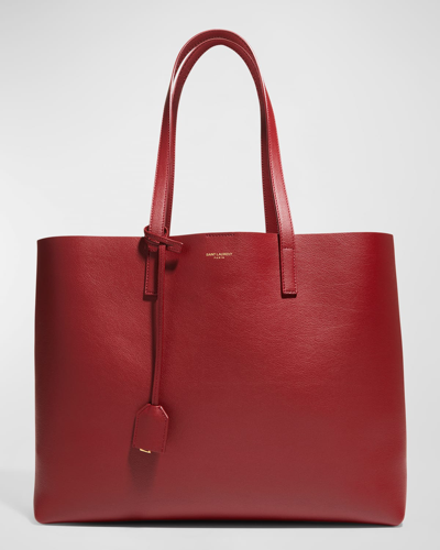Shop Saint Laurent East West Calfskin Shopping Tote Bag In Opyum Red